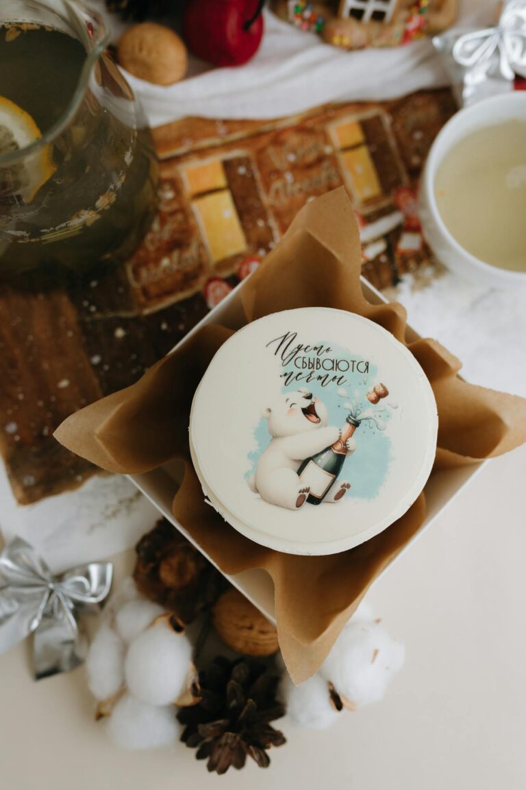 A festive cake with a whimsical illustrated character, perfect for holiday celebrations.